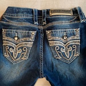 Rock Revivals mid rise boot cut jeans (size 27)